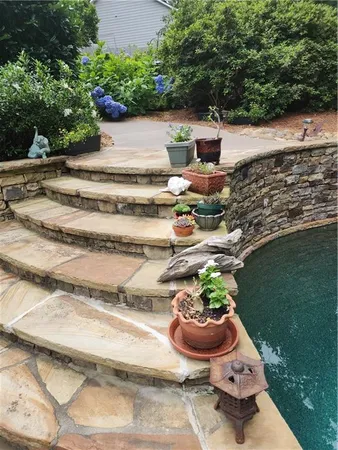 a view of a backyard with sitting area