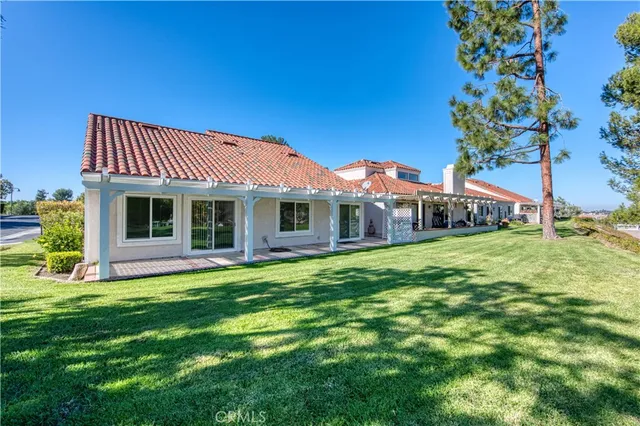 a front view of a house with a garden and porch