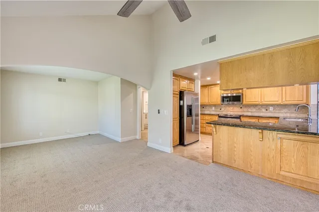 an empty room with windows and entrance