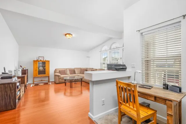 a living room with furniture and a window