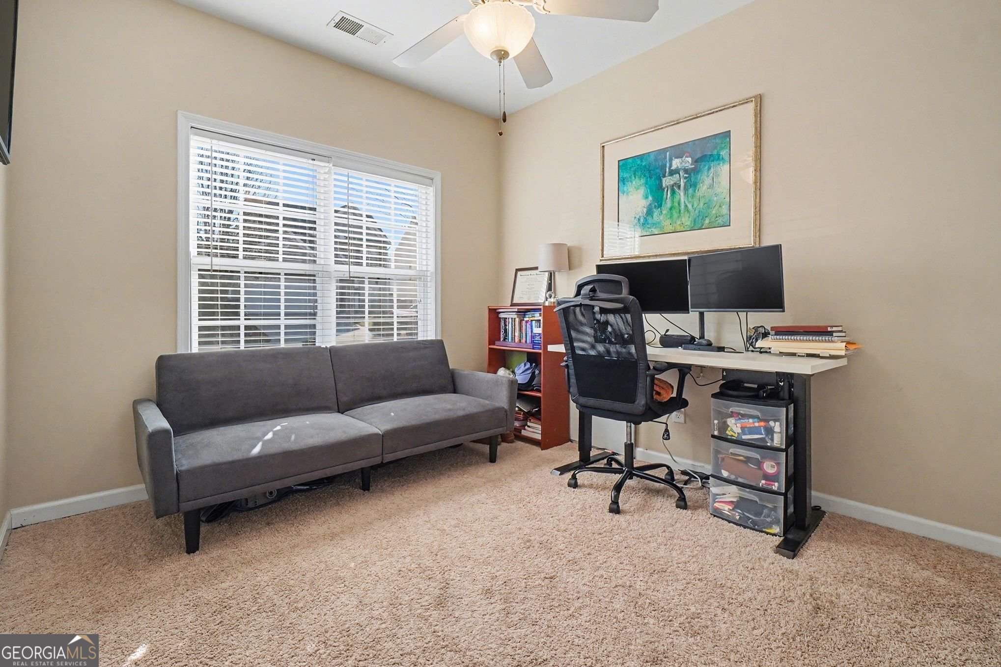 310 Turtle Pointe Drive Carrollton, GA 30116 - Photo 13 of 32 a view of a livingroom with workspace and a couch