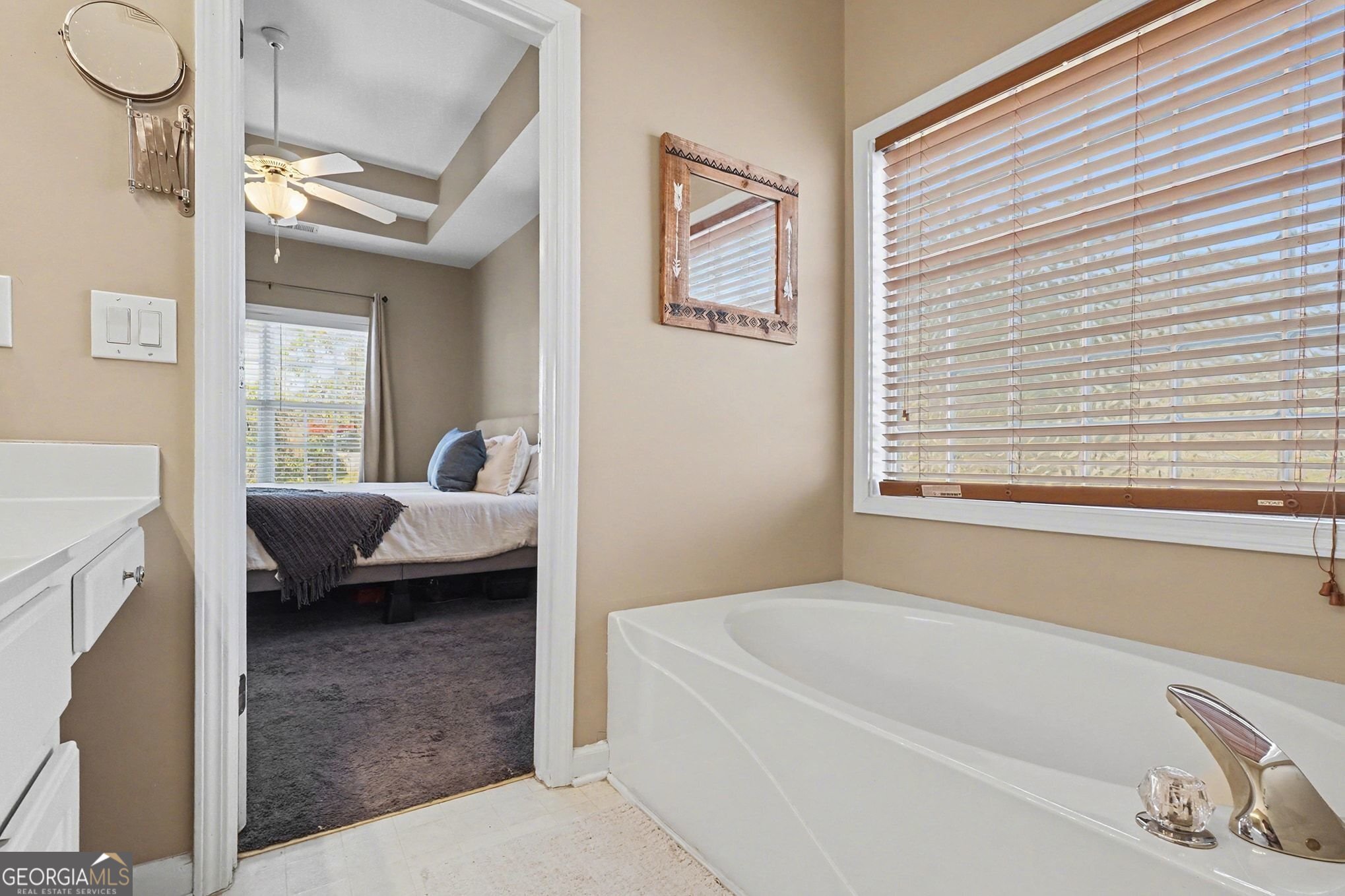 310 Turtle Pointe Drive Carrollton, GA 30116 - Photo 20 of 32 a en suite spacious bathroom with a tub double vanity and window
