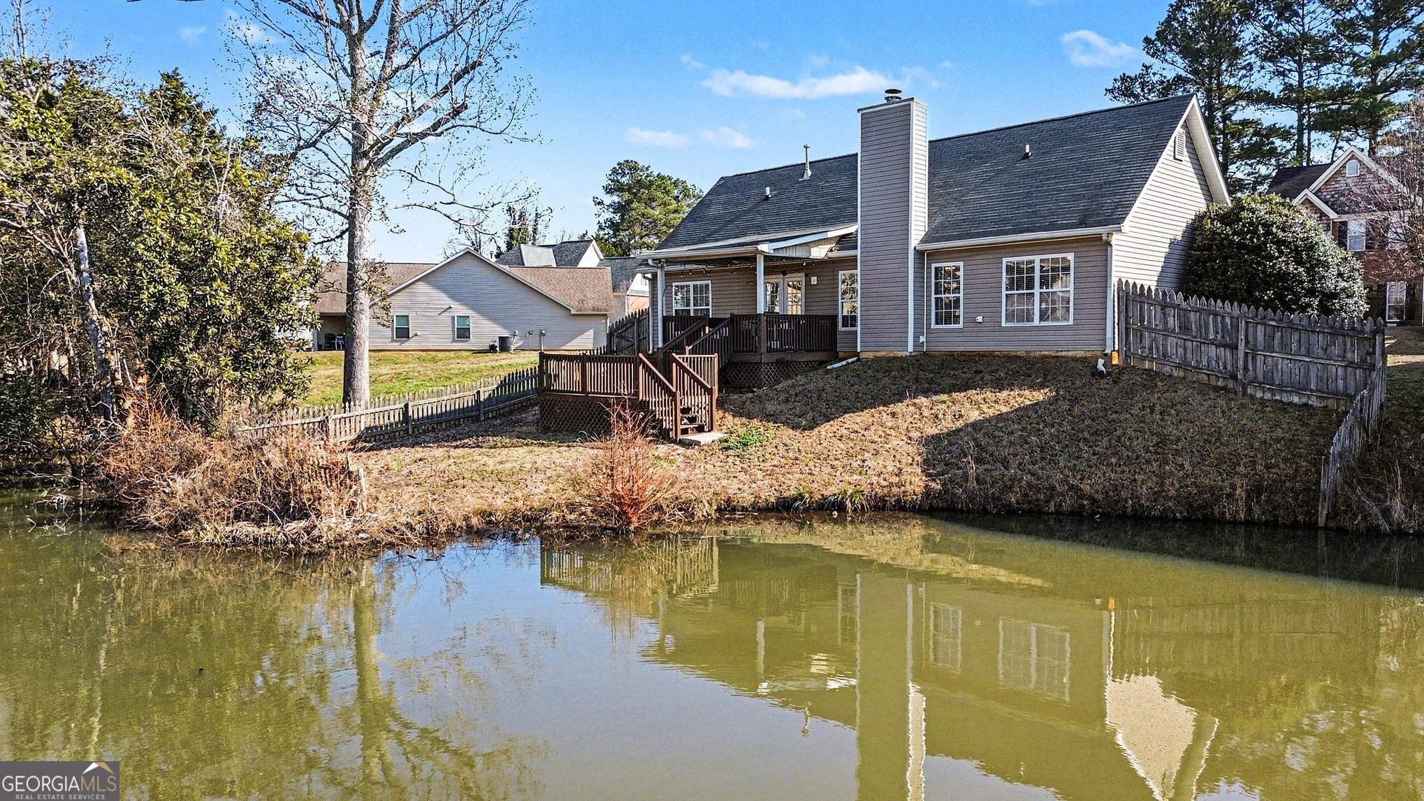 310 Turtle Pointe Drive Carrollton, GA 30116 - Photo 30 of 32 a front view of a house with swimming pool
