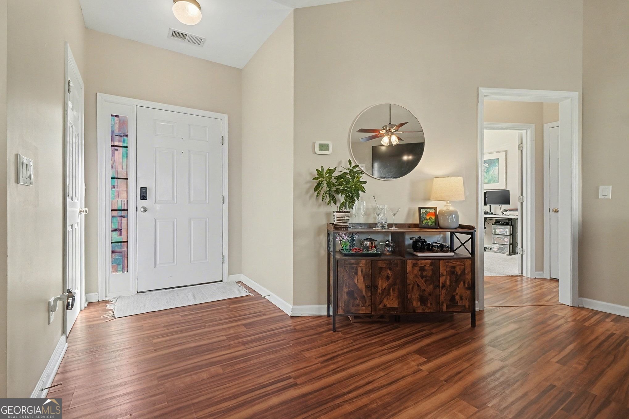310 Turtle Pointe Drive Carrollton, GA 30116 - Photo 4 of 32 an entryway and livingroom with furniture