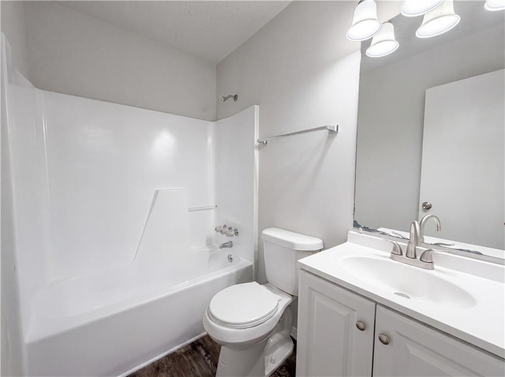 6830 Earlhurst Road Atlanta, GA 30349 - Photo 21 of 27 a bathroom with a sink toilet and shower