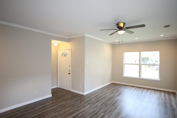 2612 Isabella Street Houston, TX 77004 - Photo 11 of 34 wooden floor in an empty room with a window