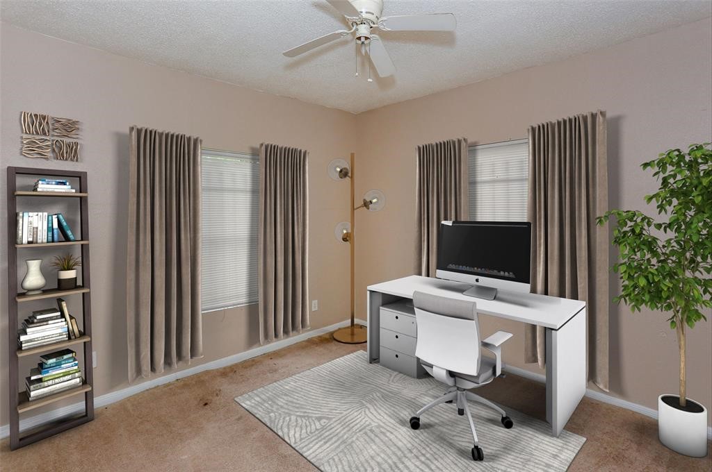 2612 Isabella Street Houston, TX 77004 - Photo 5 of 34 a view of a workspace with furniture and a potted plant
