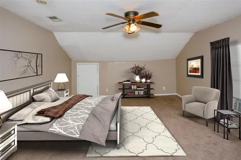 a bed room with a bed and a couch