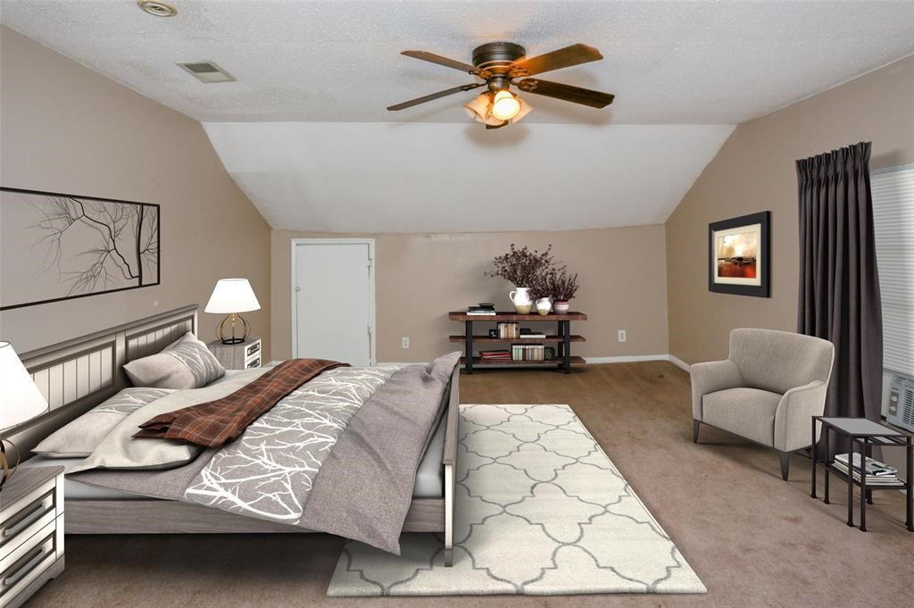 2612 Isabella Street Houston, TX 77004 - Photo 6 of 34 a bed room with a bed and a couch