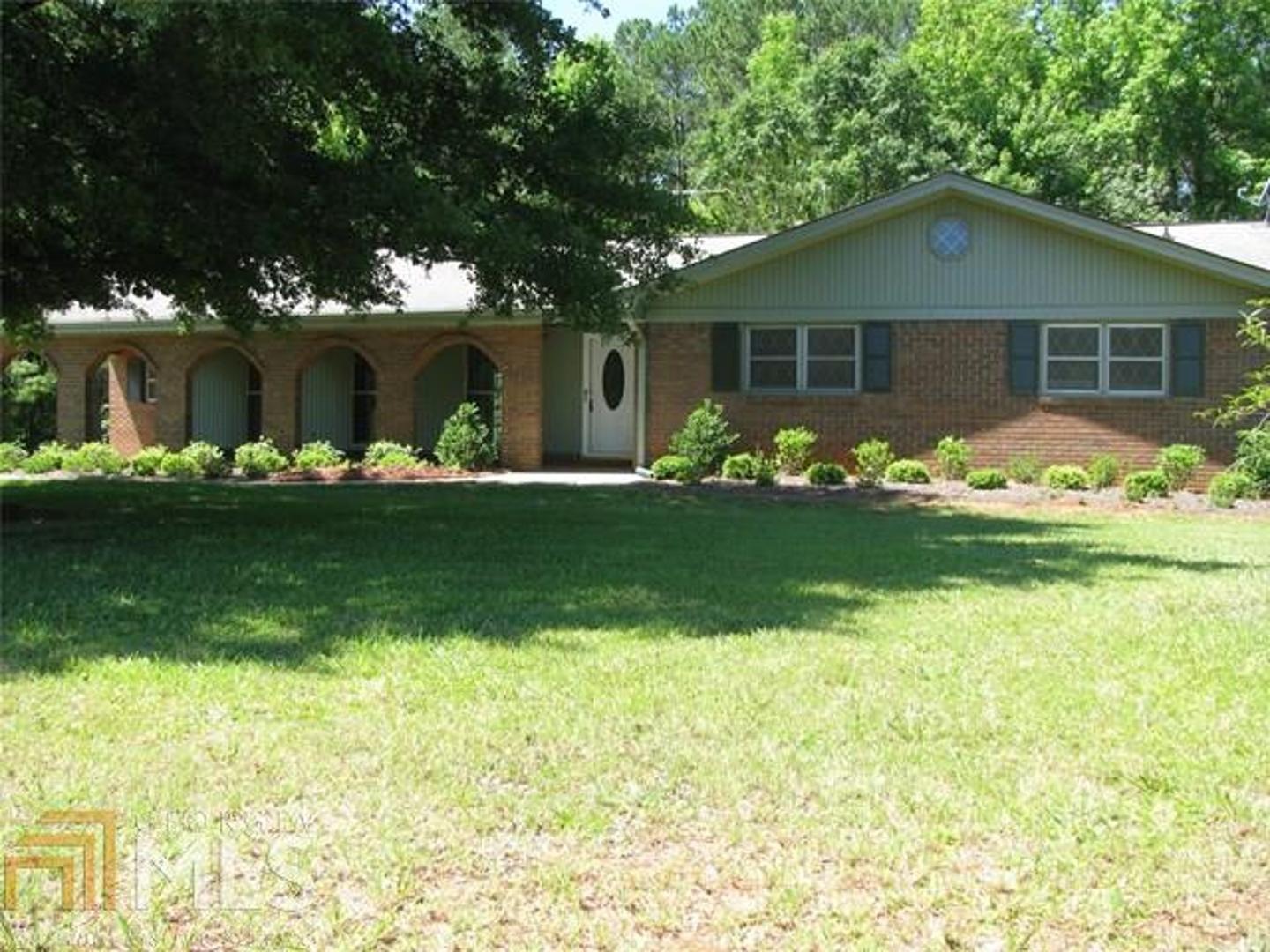 535 Keys Ferry Road Jackson, GA 30233 - Photo 1 of 1 a front view of a house with garden