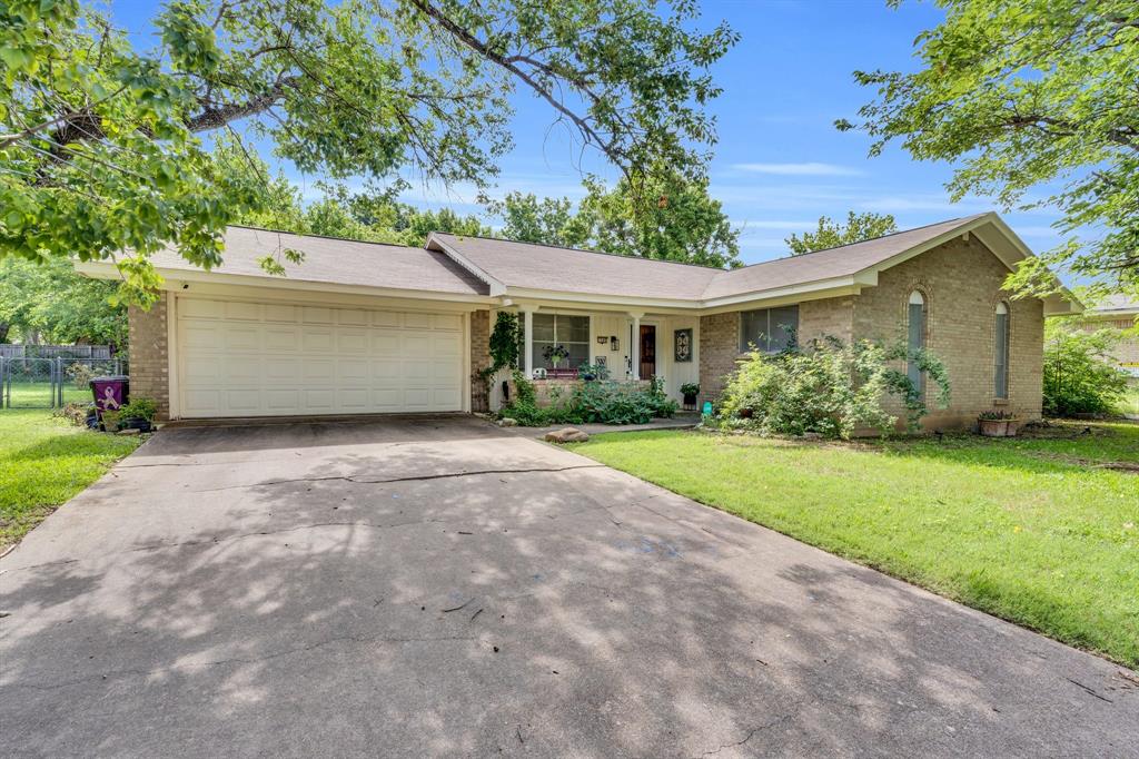 1502 Yucca Street Midlothian, TX 76065 - Photo 1 of 1 Ranch-style house with brick siding, a porch, a garage, and driveway