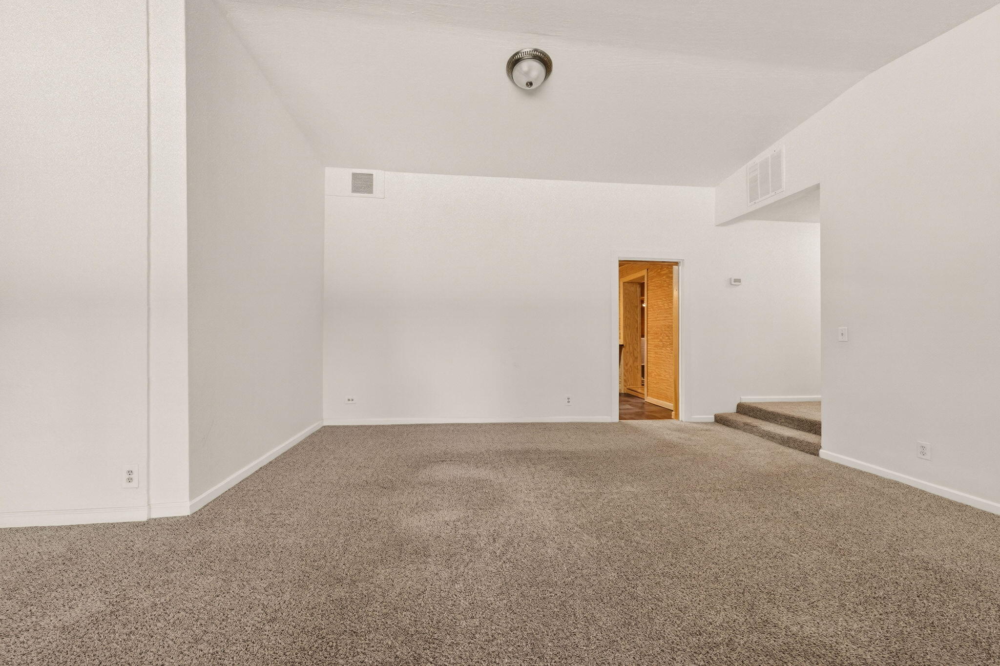 7682 Brokeoff Meadows Road Shingletown, CA 96088 - Photo 19 of 61 a view of an empty room with wooden floor