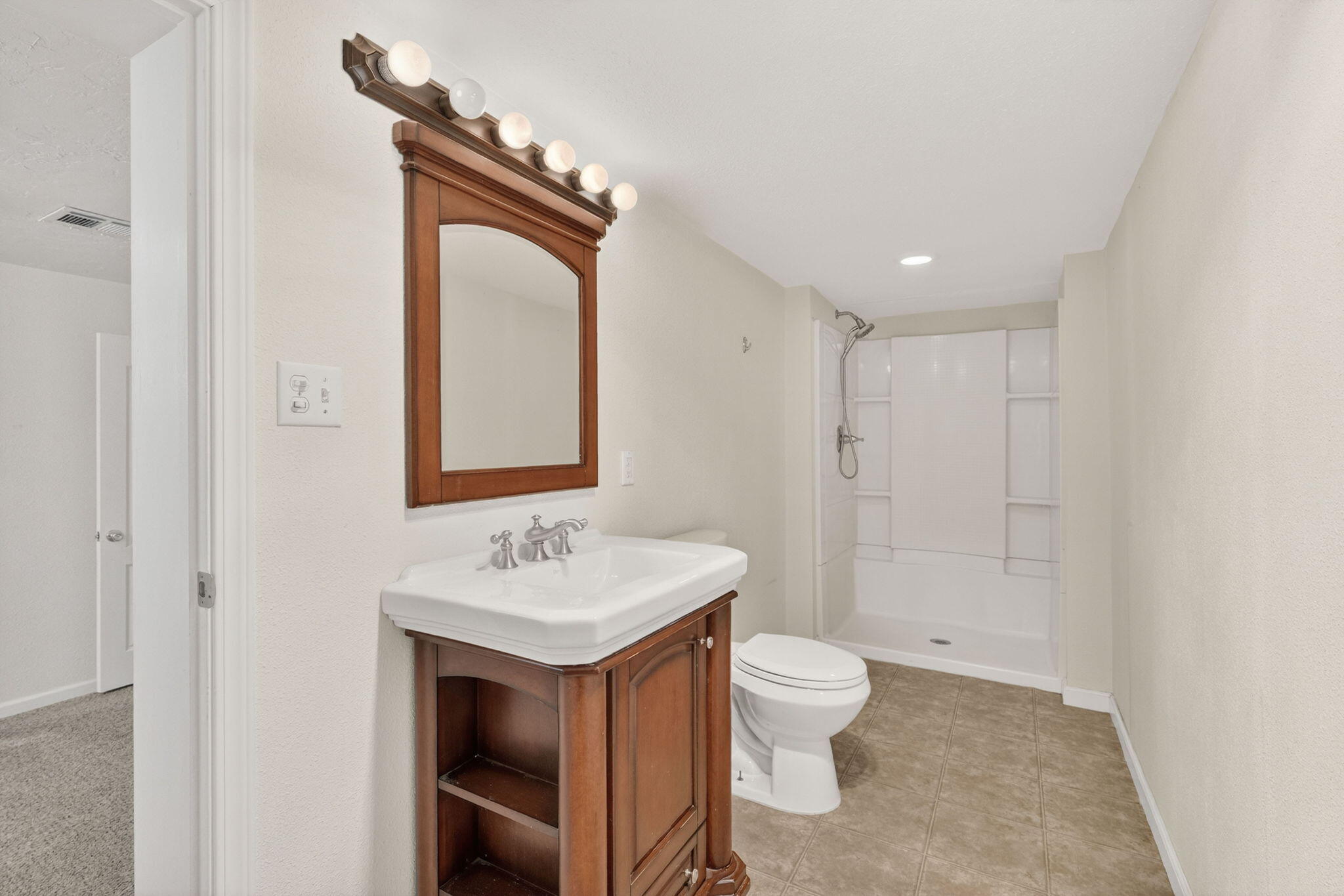 7682 Brokeoff Meadows Road Shingletown, CA 96088 - Photo 22 of 61 a bathroom with a toilet sink and mirror