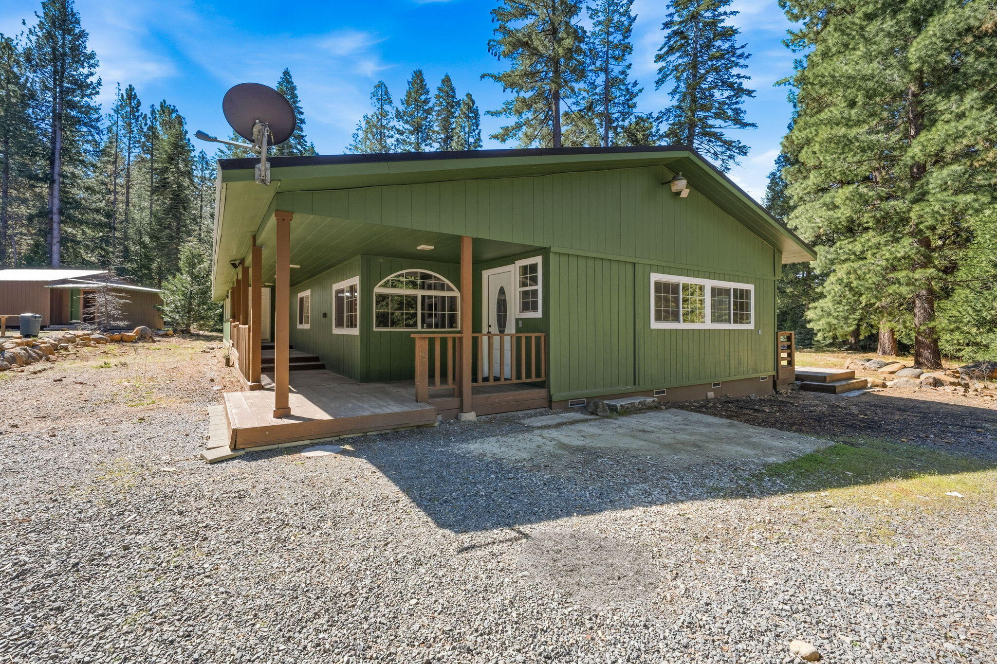 7682 Brokeoff Meadows Road Shingletown, CA 96088 - Photo 4 of 61 a front view of a house with a yard