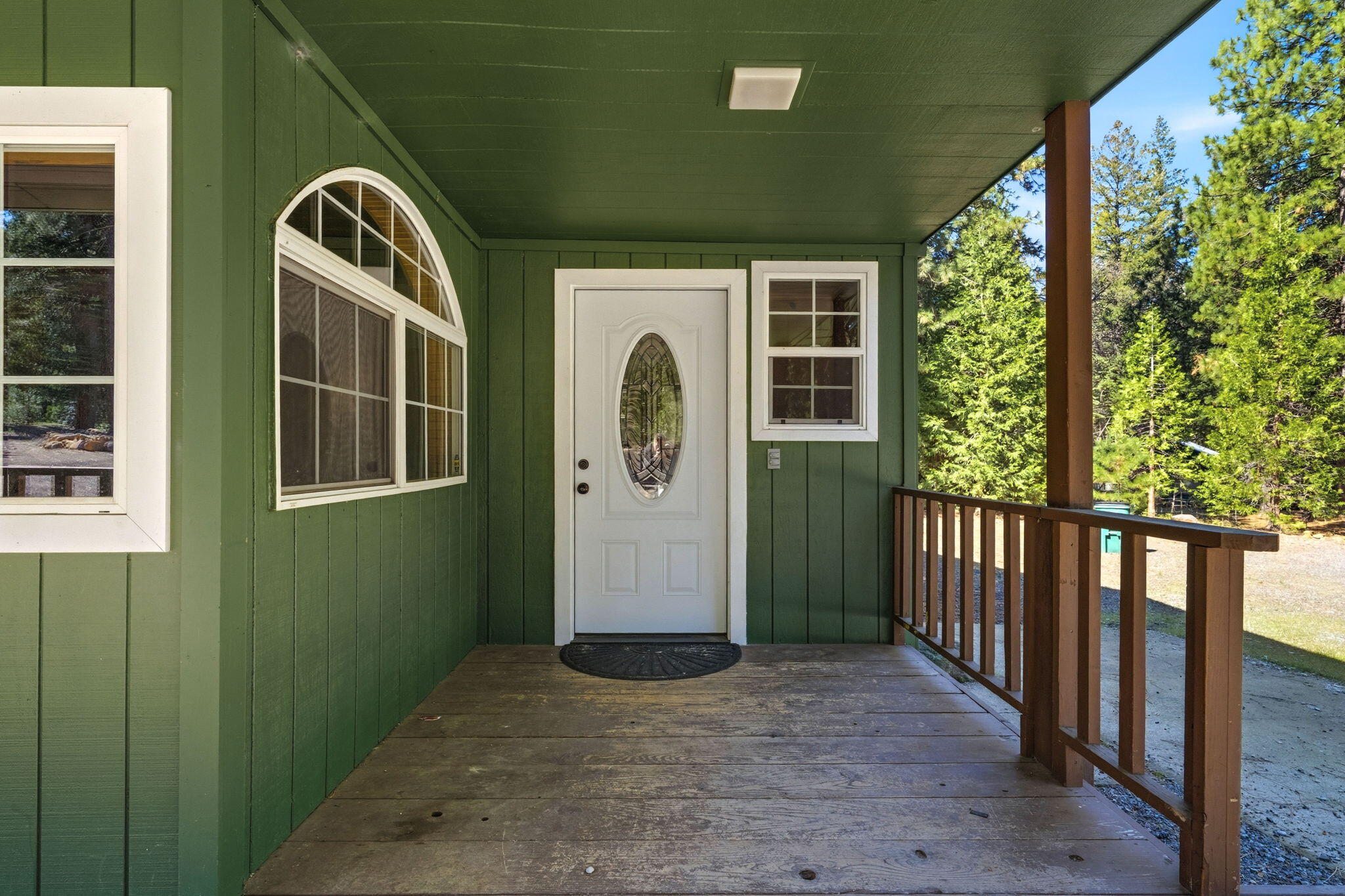 7682 Brokeoff Meadows Road Shingletown, CA 96088 - Photo 6 of 61 a front view of a house with garden