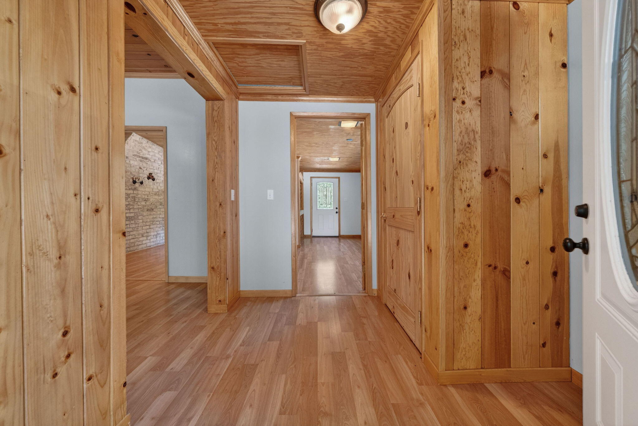 7682 Brokeoff Meadows Road Shingletown, CA 96088 - Photo 7 of 61 a view of a hallway with wooden floor and staircase