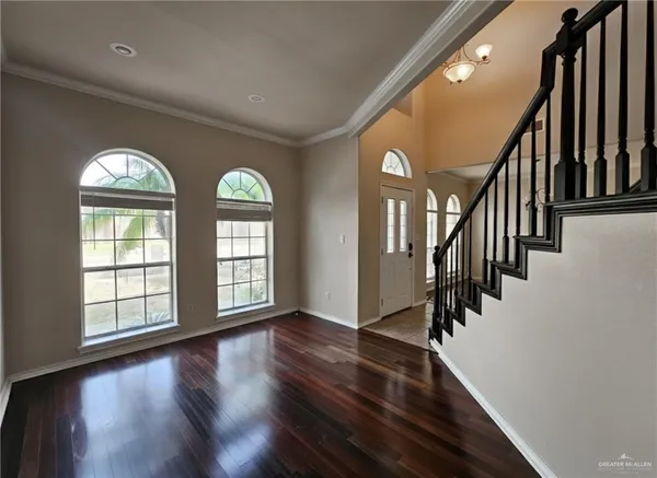 a view of an entryway with wooden floor
