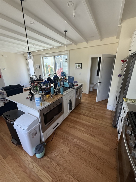 65 Cameron Street, Unit 3 Brookline, MA 02445 - Photo 2 of 16 a view of a room with gym equipment