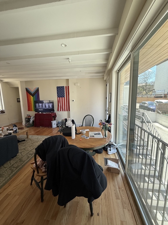 65 Cameron Street, Unit 3 Brookline, MA 02445 - Photo 6 of 16 a view of a livingroom with furniture window and wooden floor