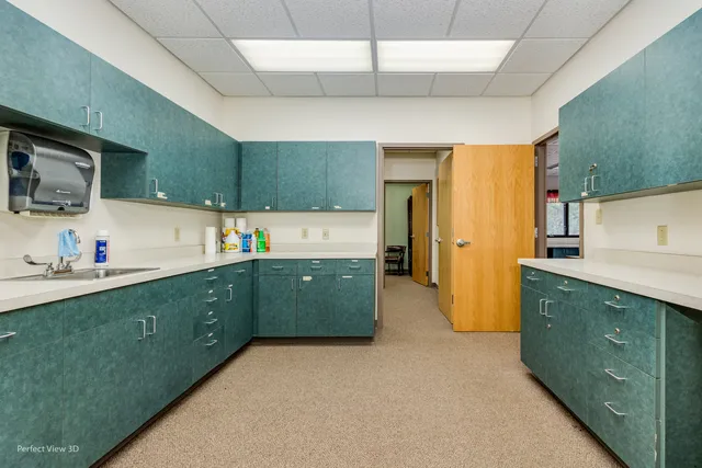 a kitchen with cabinets a sink and appliances