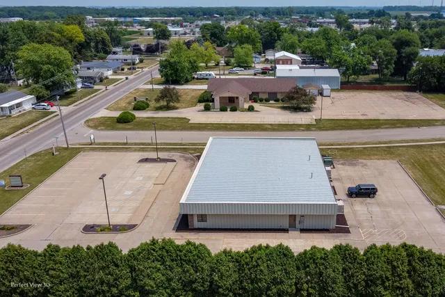 an aerial view of a house with garden space sitting space and swimming pool