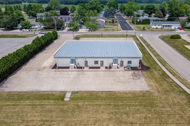 a view of swimming pool with outdoor seating and plants
