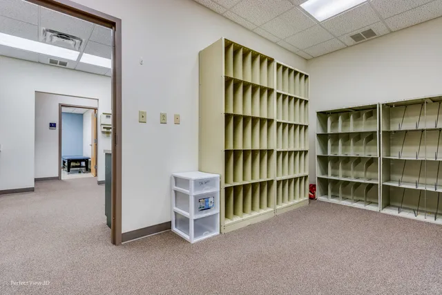 a view of an empty room with empty shelves