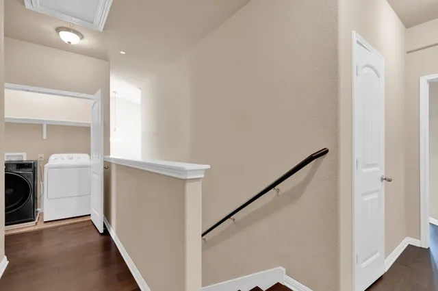 a view of hallway with washer and dryer