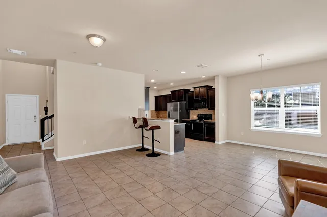 a view of a livingroom with furniture and a window
