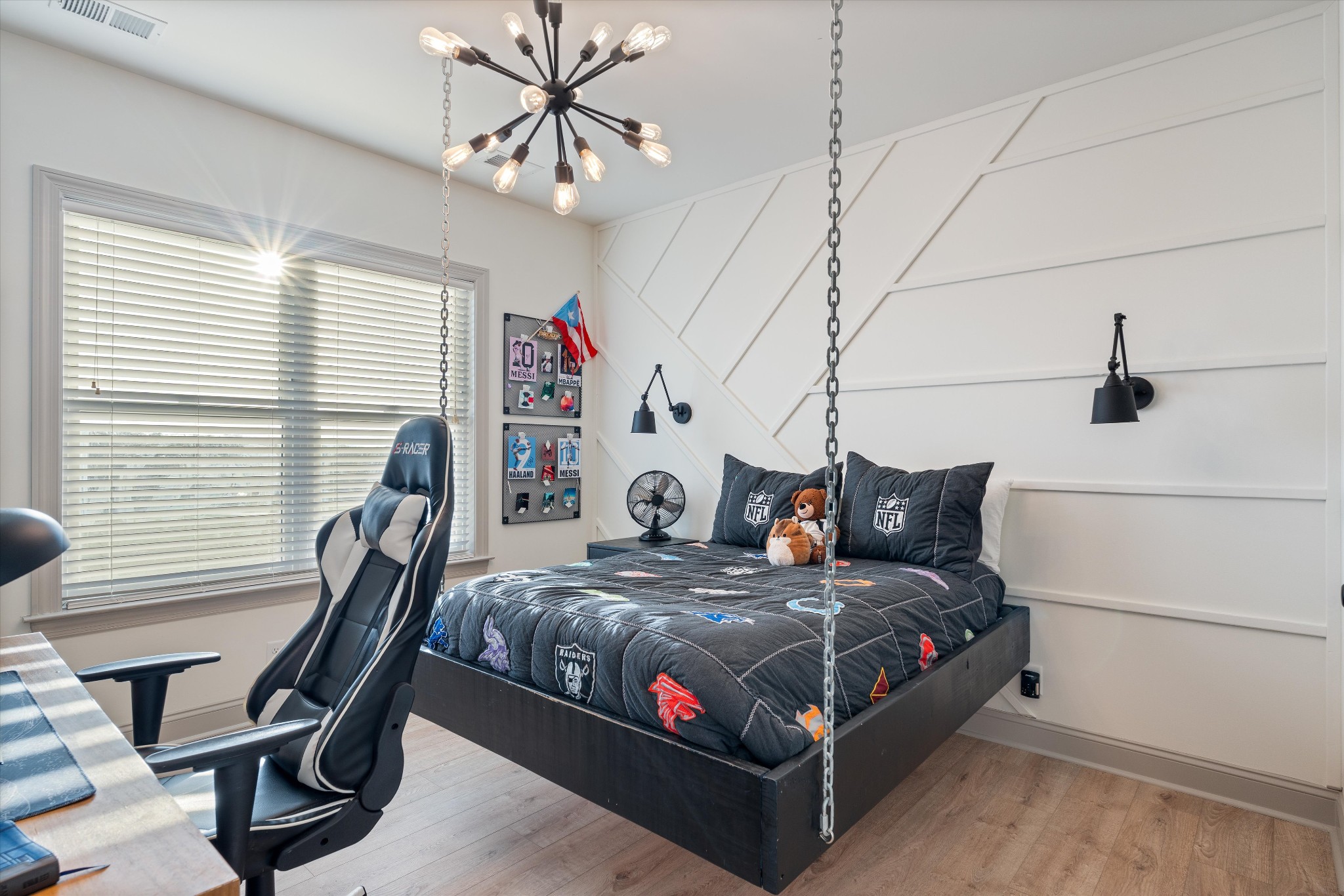 7314 Dug Hill Road Bon Aqua, TN 37025 - Photo 26 of 79 a bedroom with a bed and a chandelier