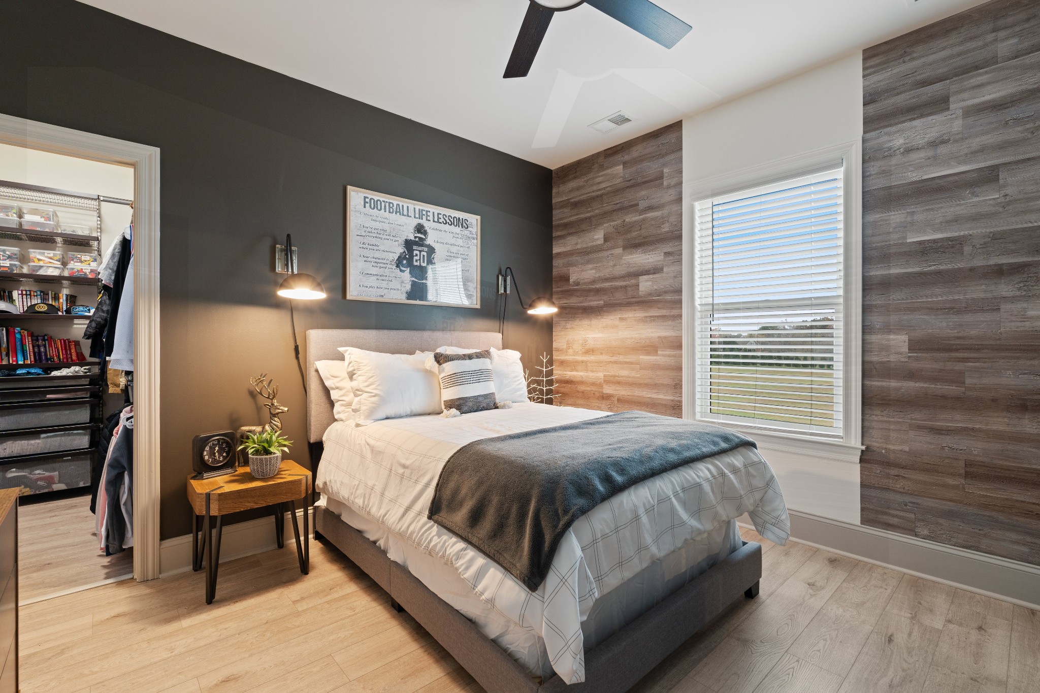 7314 Dug Hill Road Bon Aqua, TN 37025 - Photo 27 of 79 a bedroom with a bed a mirror and a large window