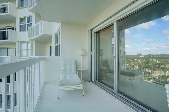 a view of a porch with a floor to ceiling window