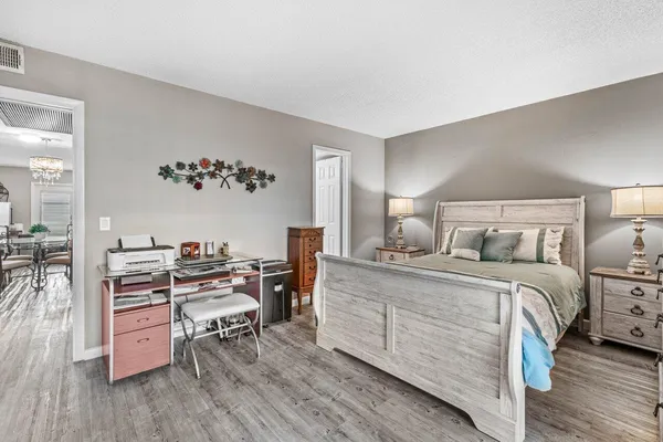 a bedroom with a bed and a table in it