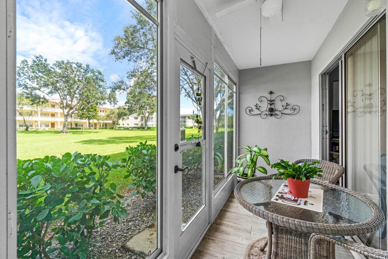 3 Mansfield B Boca Raton, FL 33434 - Photo 27 of 35 a view of a porch with furniture and garden