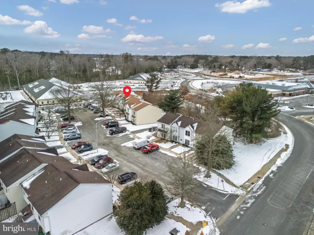 a bed room with a bed and a chandelier