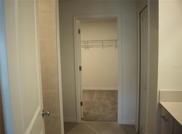a bathroom with a glass door shower