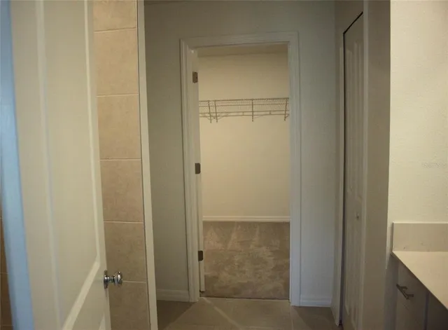 a bathroom with a glass door shower