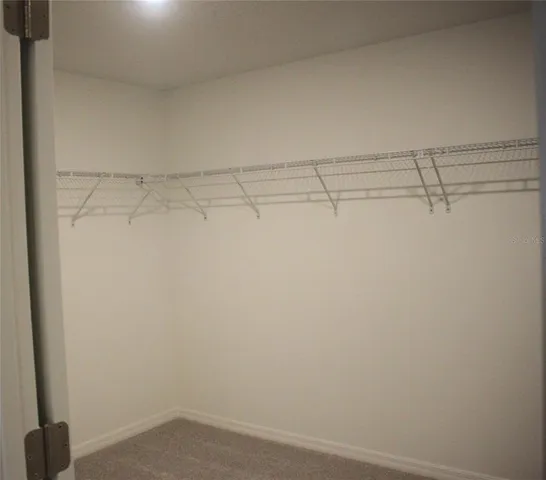 a view of a room with racks on the wall