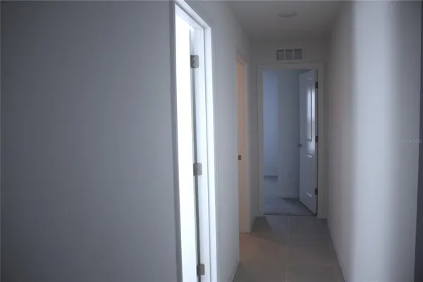 a view of a hallway with a closet