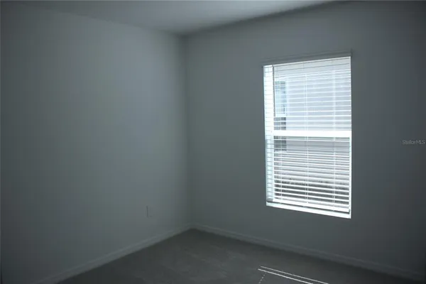 a view of a room that has a window in it
