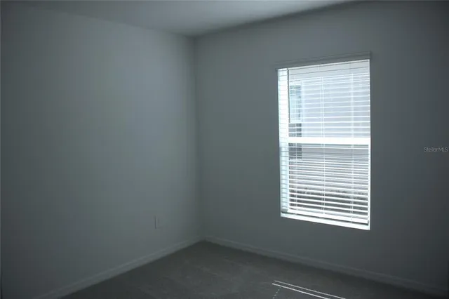 a view of a room that has a window in it