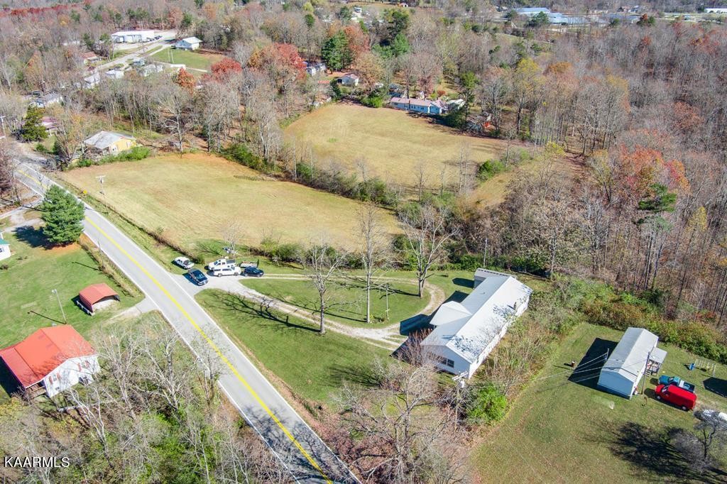 1425 West Cove Road Jamestown, TN 38556 - Photo 2 of 20 an aerial view of a house with a yard and lake view