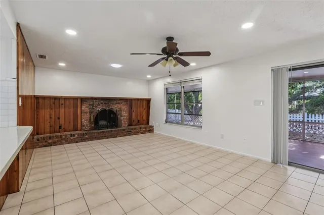 a view of an empty room and a window