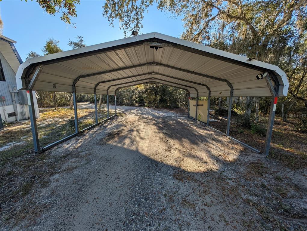 30810 Northeast 78th Street Fort McCoy, FL 32134 - Photo 5 of 9 a view of a house with a yard