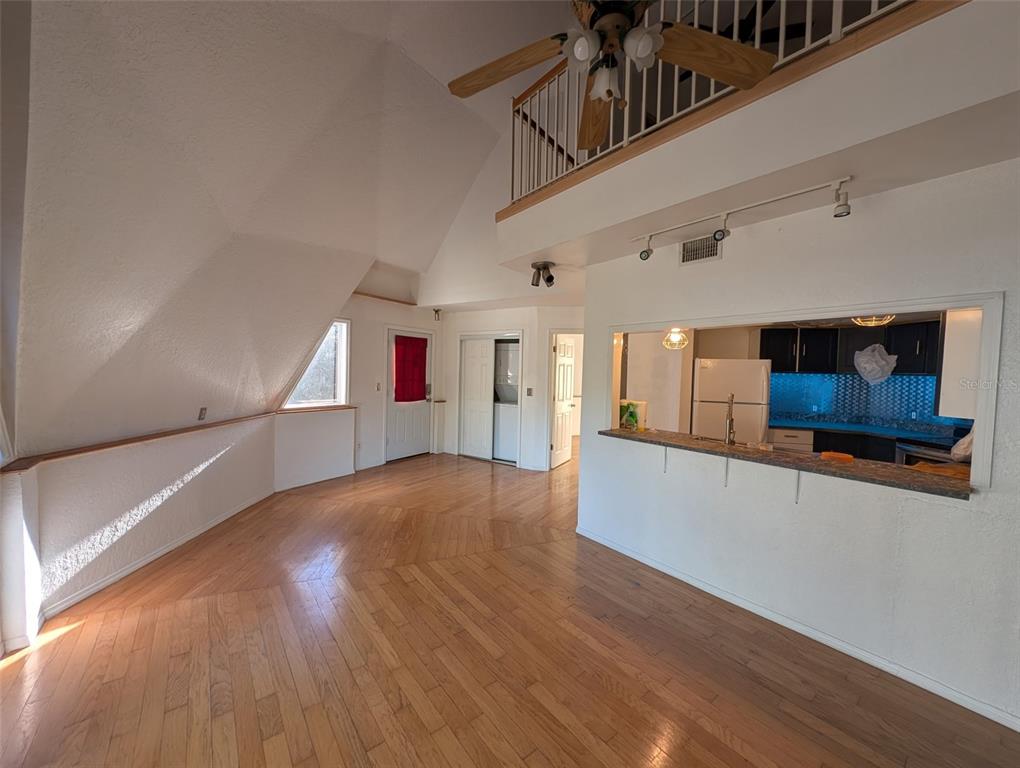 30810 Northeast 78th Street Fort McCoy, FL 32134 - Photo 9 of 9 a view of an empty room with wooden floor