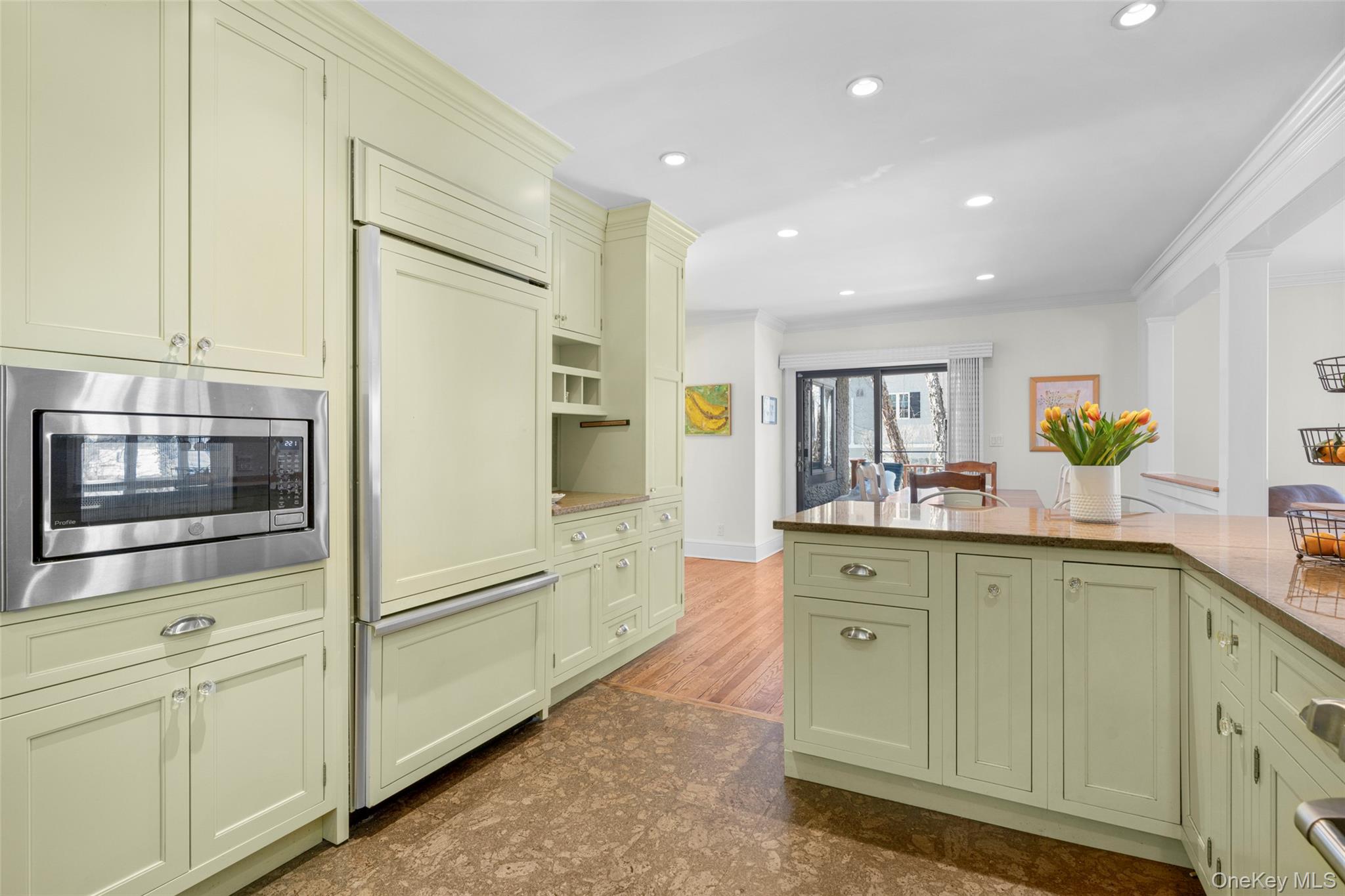 7 Poplar Road Larchmont, NY 10538 - Photo 14 of 46 a kitchen with cabinets and stainless steel appliances
