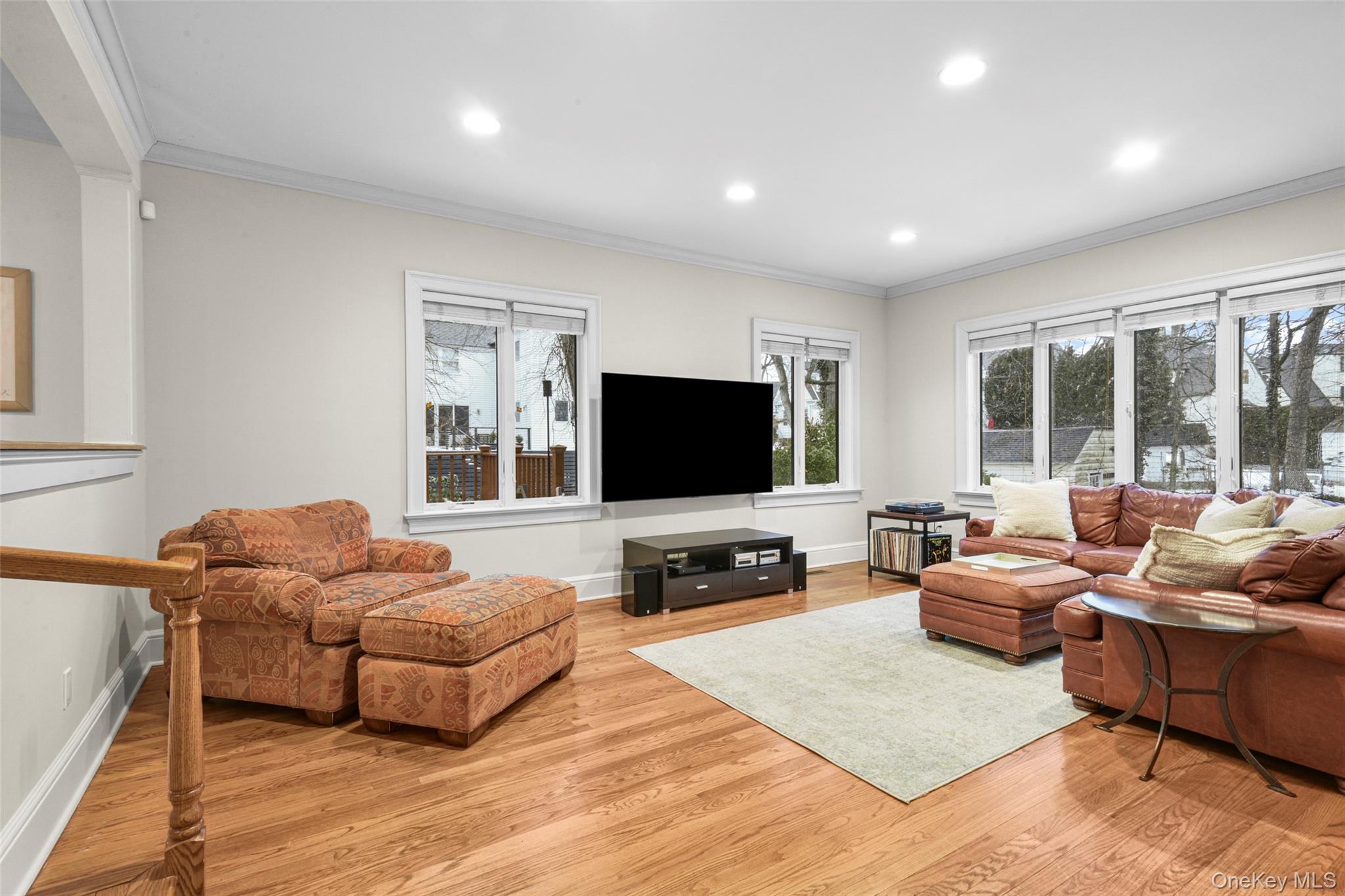 7 Poplar Road Larchmont, NY 10538 - Photo 17 of 46 a living room with furniture and a flat screen tv