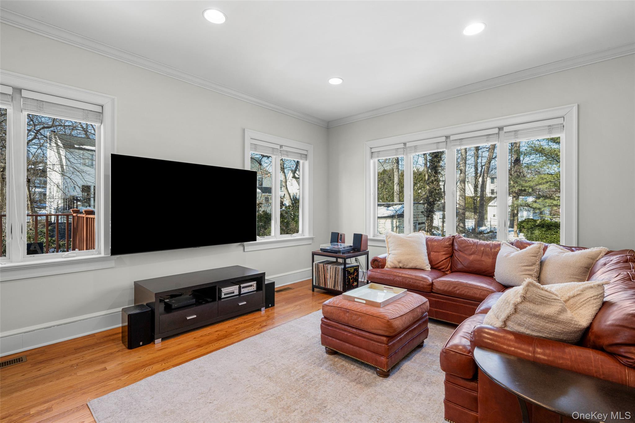 7 Poplar Road Larchmont, NY 10538 - Photo 18 of 46 a living room with furniture and a flat screen tv