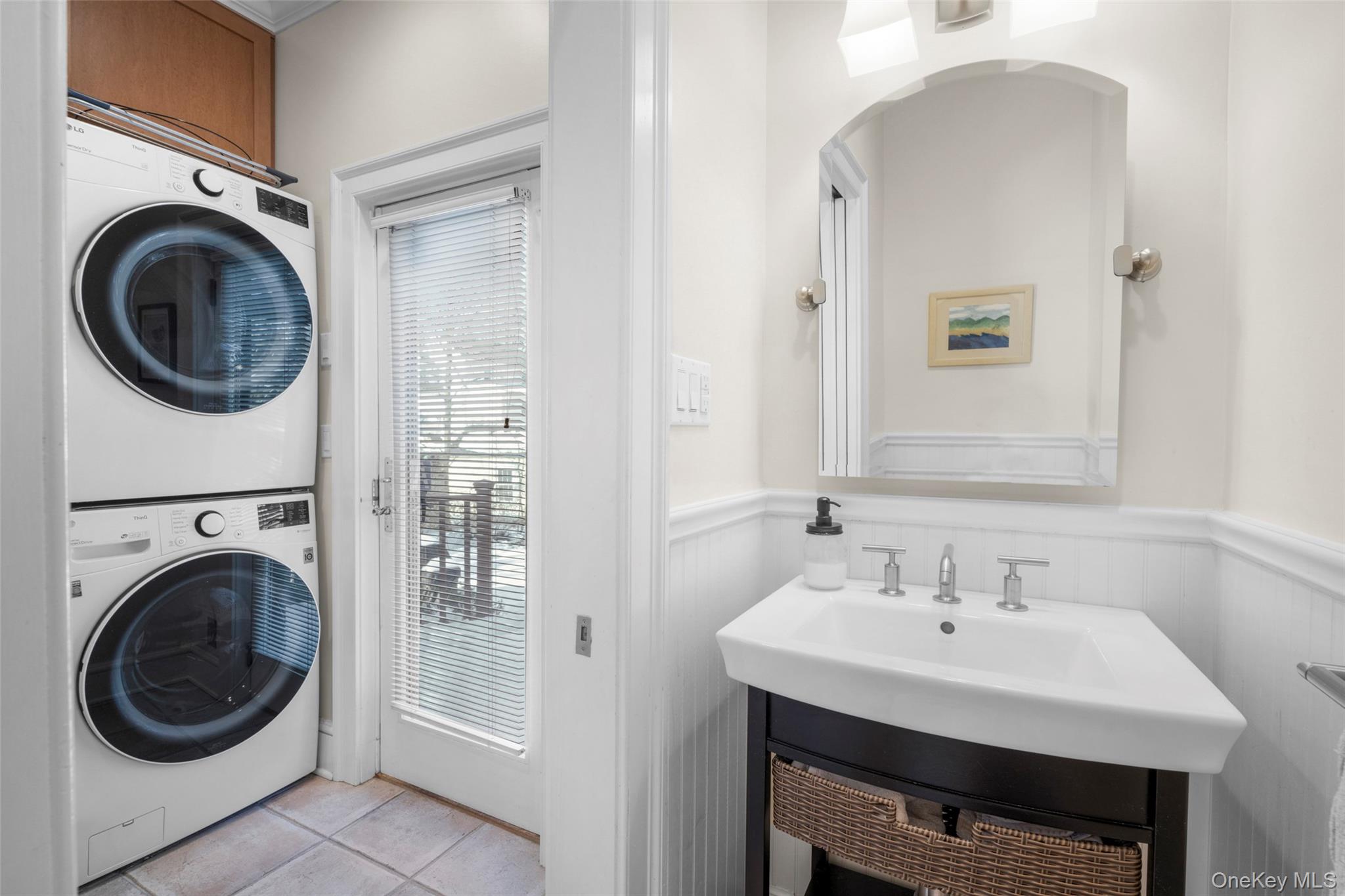 7 Poplar Road Larchmont, NY 10538 - Photo 22 of 46 a bathroom with a sink a mirror and a washer