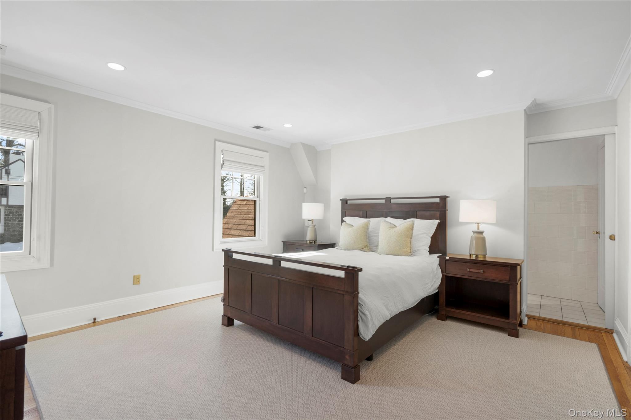 7 Poplar Road Larchmont, NY 10538 - Photo 23 of 46 a large bedroom with a bed and window